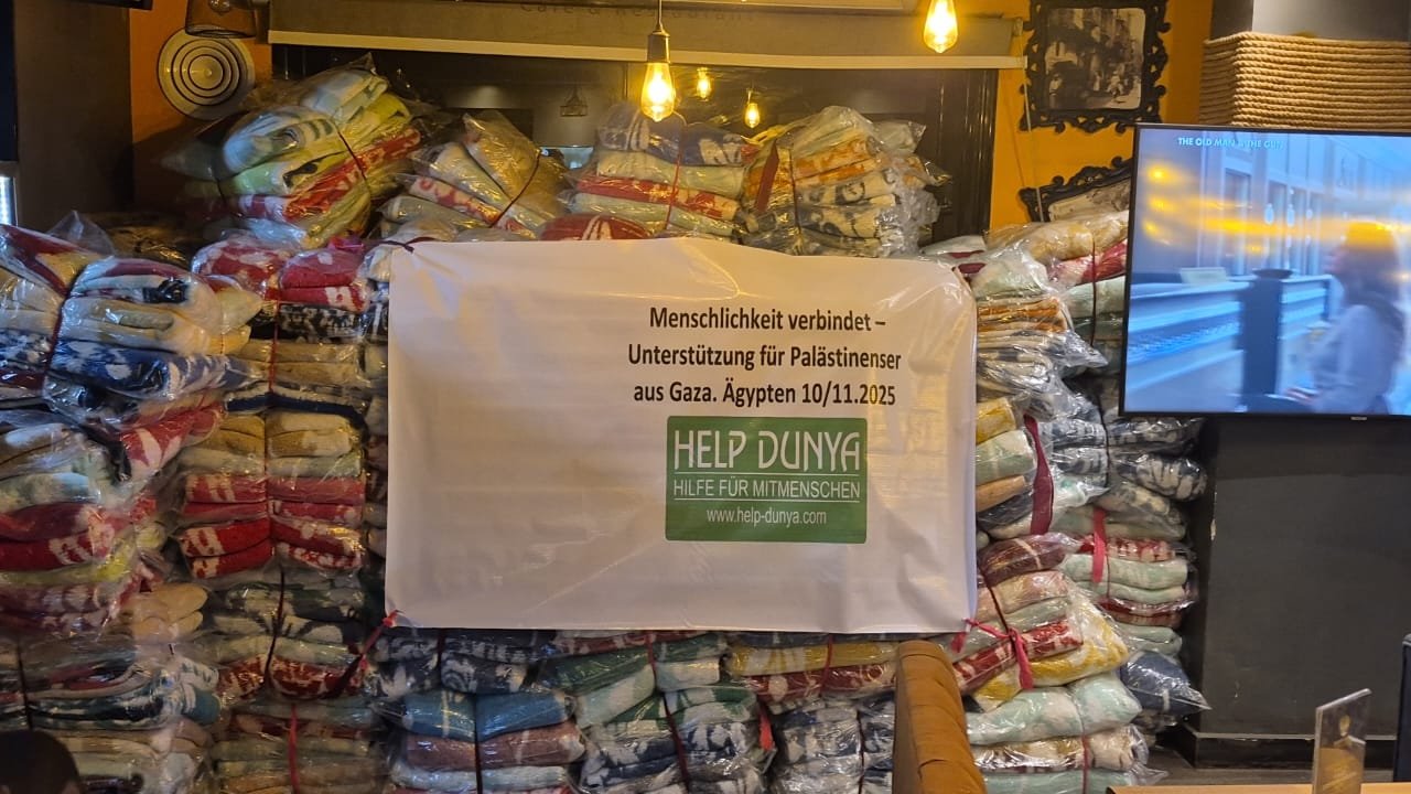 جمعية هيلب دنيا توزع  حرامات على الاسر النازحة من  غزة بمصر 